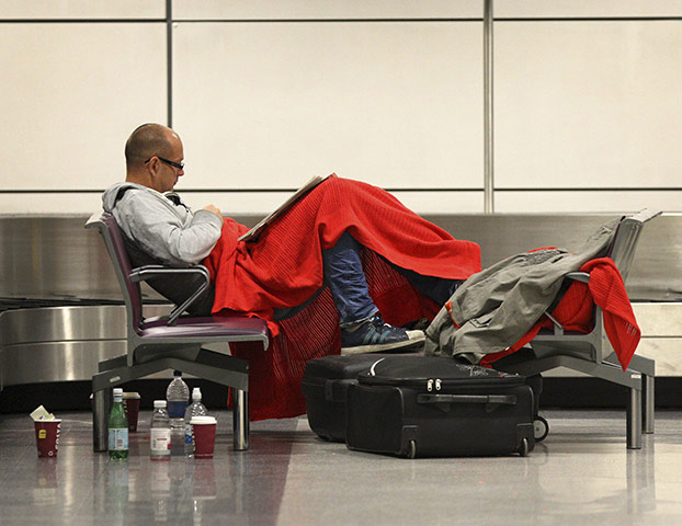 Grimsvotn volcano: A passengers rests on a chair as flights were cancelled, Edinburgh Airport