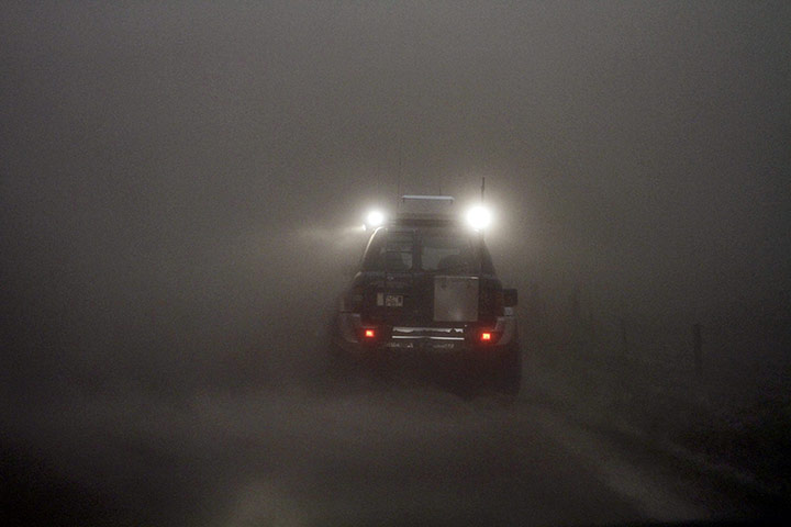 Grimsvotn volcano: A car drives through a cloud of ash at a farm near Kirkjubaejarklaustur