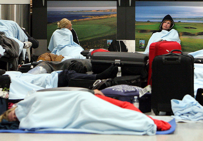 Grimsvotn volcano: Passengers rest as their flights have been cancelled at Edinburgh Airport