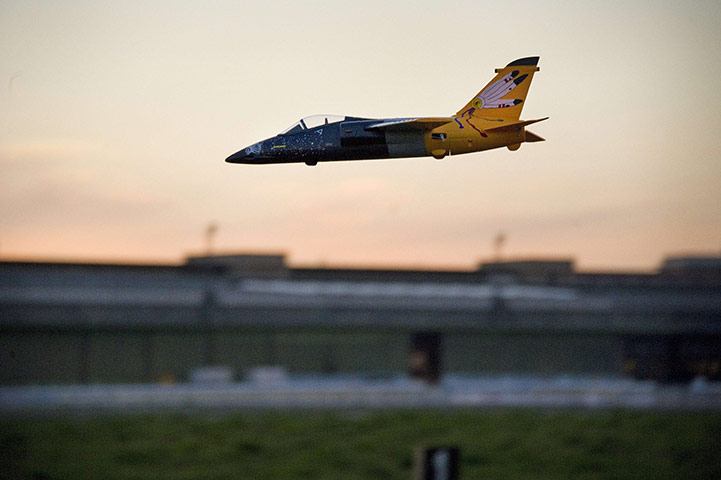 24 hours in pictures: A radio controlled airplane lands at Tempelhof airport 
