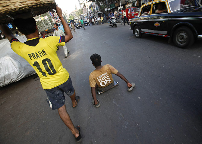 24 hours in pictures: A handicapped man in Mumbai