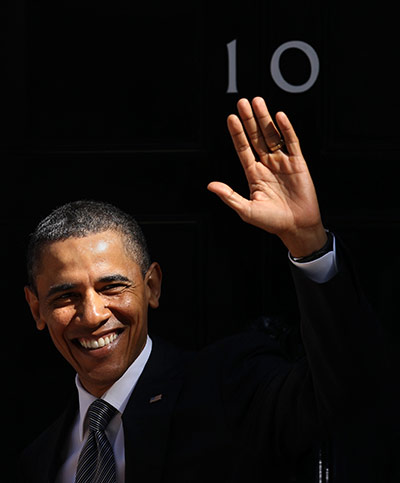 Obama UK visit: Barack Obama waves to the media as he arrives at 10 Downing Street