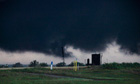 Tornadoes in US: People try to salvage items from a home after it was destroyed in Joplin
