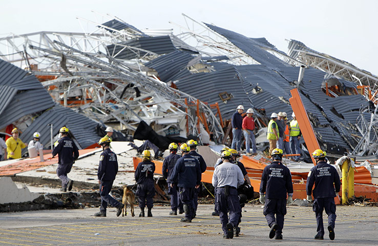 Tornadoes in US: Members of Missouri Task Force One search-and-rescue team work