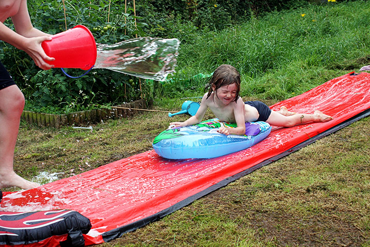 In pictures: expectation: boy whizzing down a water slide