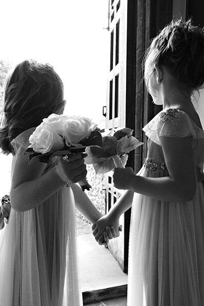 In pictures: expectation: two young bridesmaids