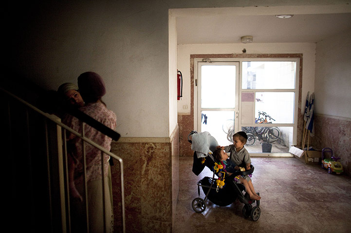 24 hours in pictures: Jewish settlers during the inauguration ceremony of new settler homes