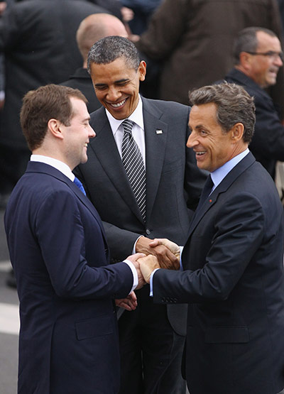 G8 summit: US President Barack Obama, Nicolas Sarkozy and Dmitry Medvedev join hands 