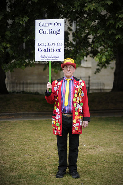 Week in Business: A protester poses during a Rally against Debt