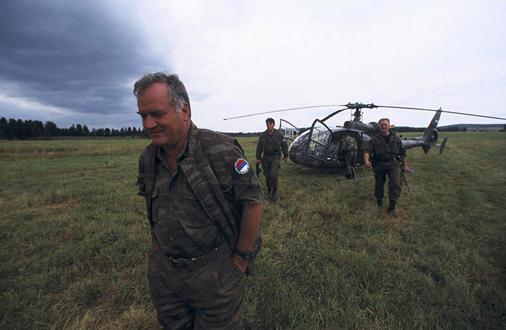 Ratko Mladic: General Ratko Mladic walks away from a helicopter in 1995