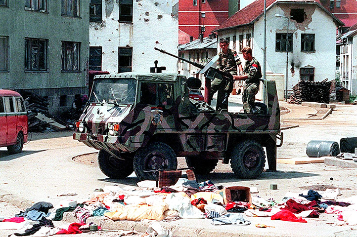 Ratko Mladic: A Bosnian Serb armed vehicle crew drives through Srebrenica in July 1995 