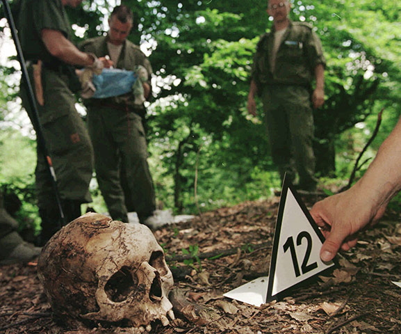 Ratko Mladic: A forensic expert places a number next to the skull of a Srebrenica victim