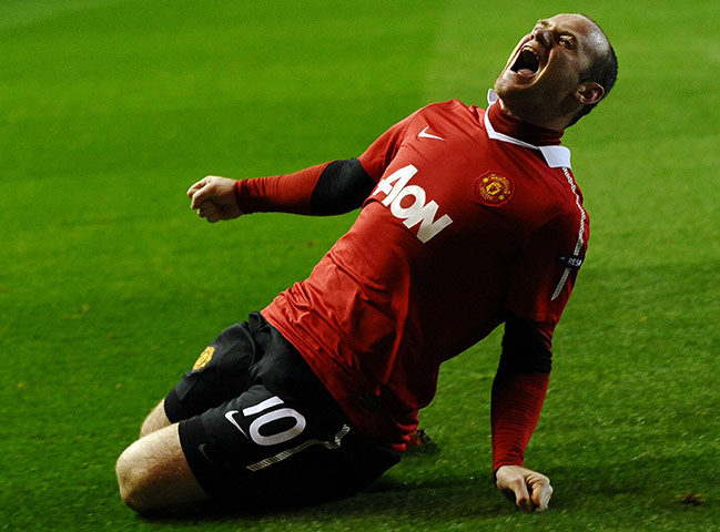 United's road to Wembley: Wayne Rooney celebrates after scoring from the penalty spot against Rangers