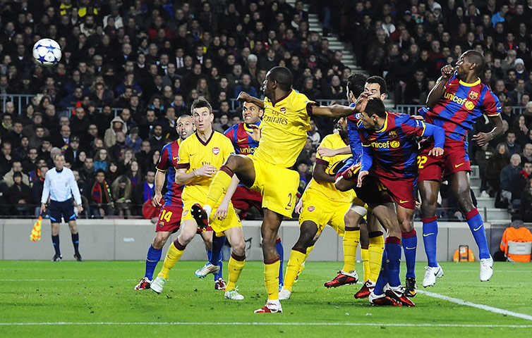 Barcelona: Arsenal's Abou Diaby (C) watches as an o