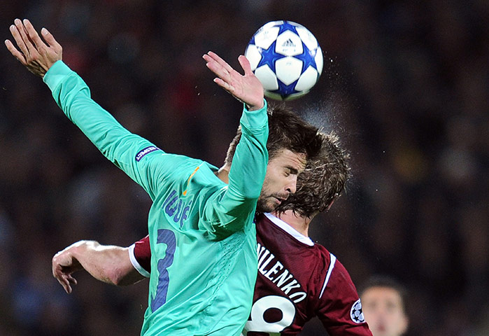 Barcelona: Gerard Pique (L) of FC Barcelona vies wi