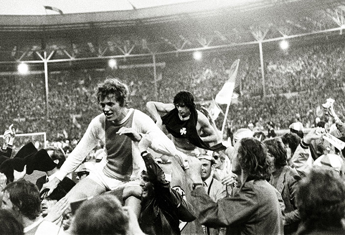 Wembley European Finals: Jubilant supporters carry Arie Haan, left, around the pitch 
