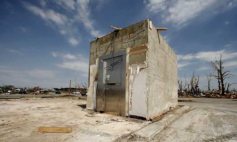 24 Hours: A vault is all that remains of the Commerce Bank after the tornado