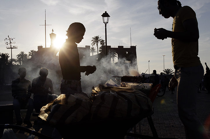 24 Hours: A street vendor sells kebabs in Tripoli
