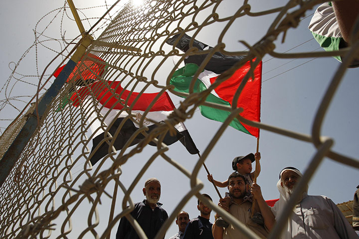 Egypt Gaza border: Palestinians take part in a rally at the gate of Rafah border 