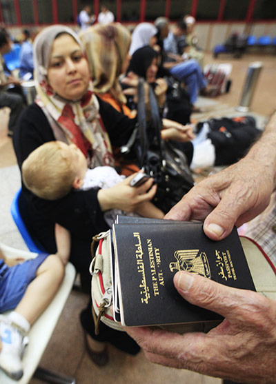 Egypt Gaza border: A Palestinian holds his family's passports