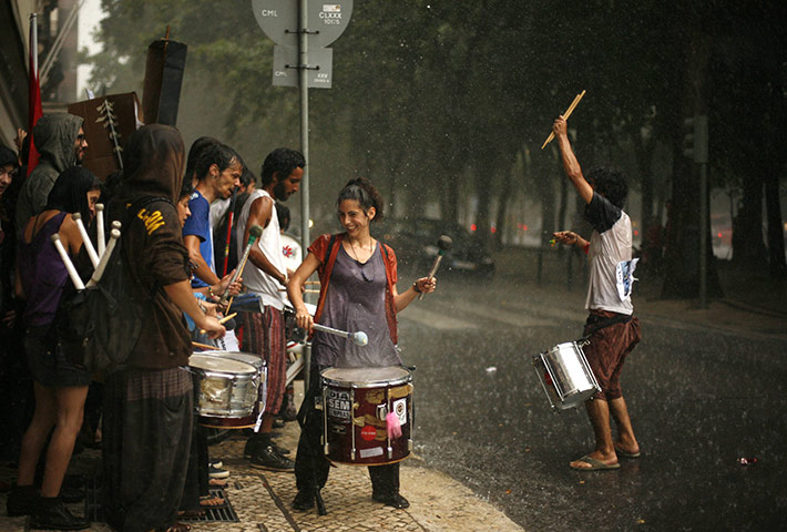 24 hours: Lisbon, Portugal: Demonstrators play drums during a protest