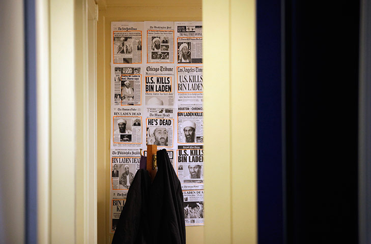 24 hours in pictures: Copies of newspaper front pages of Osama Bin Laden are hung in White House