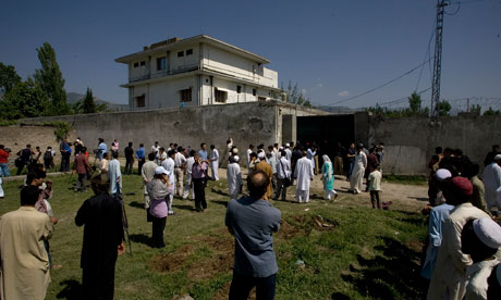 usama bin laden. Local people and media gather outside the compound where Osama bin Laden was