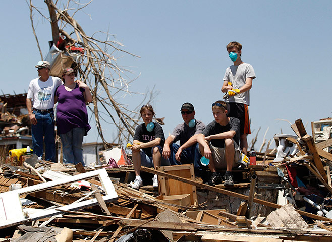 Obama in Joplin: Residents affected by tornado damage sit and watch as Barack Obama