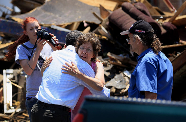 Obama in Joplin: Barack Obama is hugged by a victim of the tornado