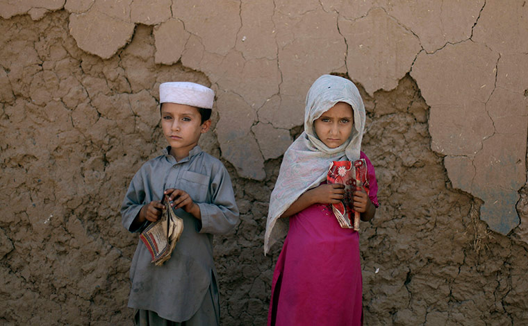 24 hours in pictures: Children waiting outside a mosque to attend an Islamic religious class