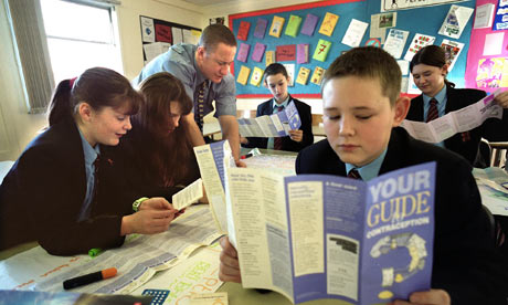 A child reads a leaflet on sex education