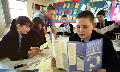 A child reads a leaflet on contraception