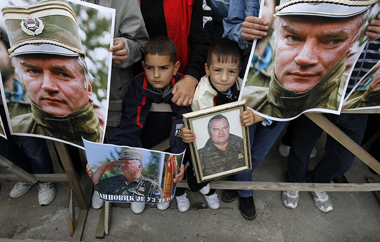 Ratko Mladic: 29 May 2011: Children hold pictures of Ratko Mladic