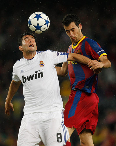Barcelona v Real Madrid: Kaka and Sergio Busquets tussle for the ball