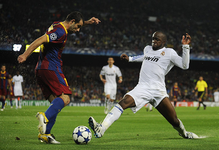 Barcelona v Real Madrid: Javier Mascherano and Lass Diarra battle for the ball