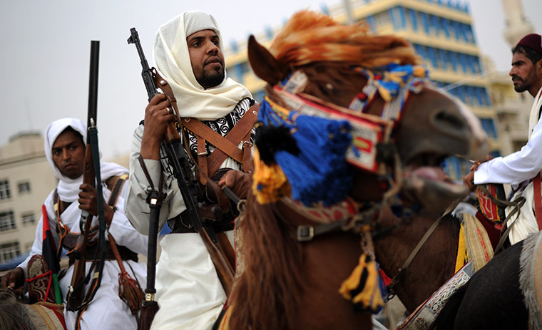 24 hours in pictures: Tribemen escort an anti-government rally in Benghazi, Libya