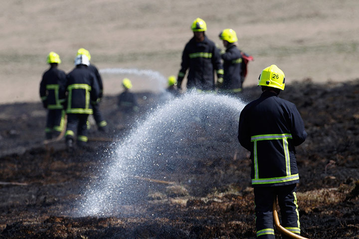 Wild fires: Firefighters tackle a moorland fire in Mytholmroyd, west Yorkshire