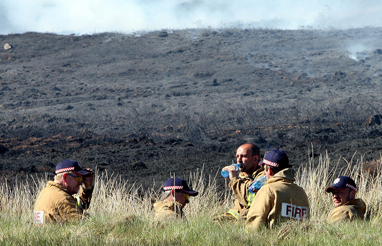 Wild fires: Firefighters take a rest from trying to contain a gorse fire in N Antrim