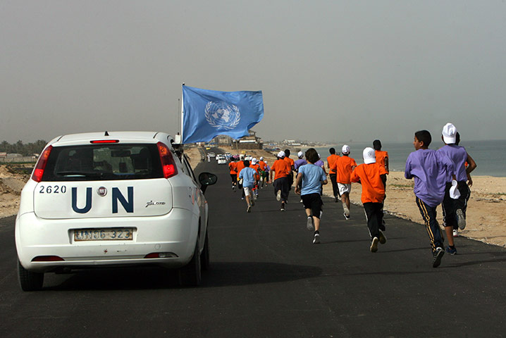 gaza marathon: A UN vehicle escorts Palestinian and foreign runners in Rafah 