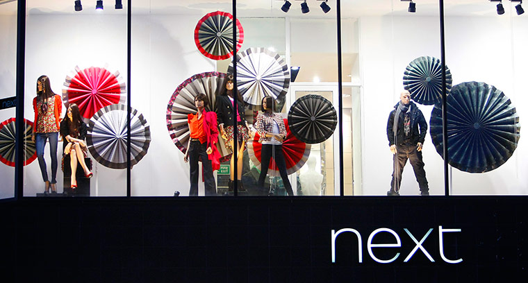 Week in business: A fashion display is seen in a Next store