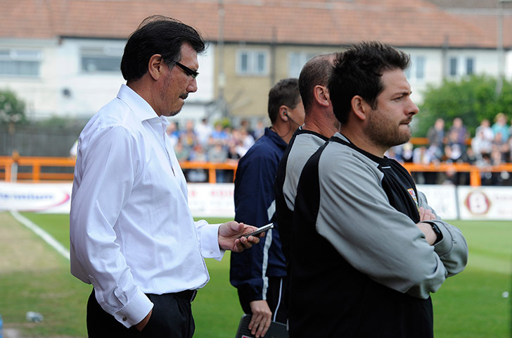 Barnet v Port Vale:  Barnet's managerial consultant Lawrie Sanchez checks scores on his phone
