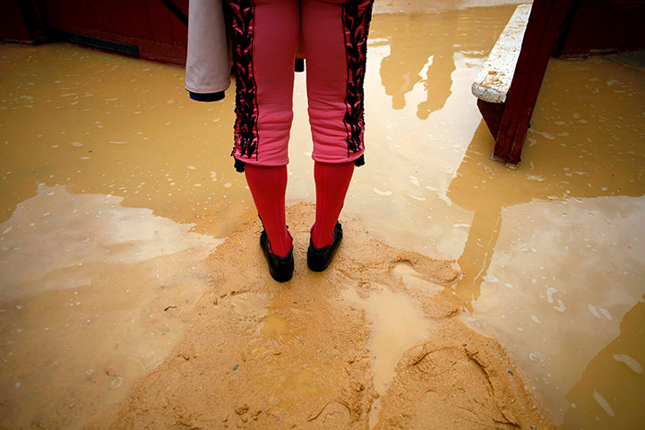 24 hours in pictures: A bullfighter looks on before a bullfight in Valencia