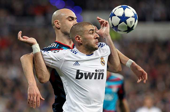 Top 50 transfer targets: Real Madrid's Karim Benzema & Lyon's Cristiano Marques fight for the ball