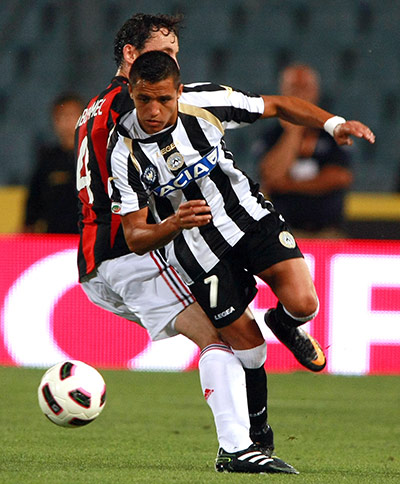 Top 50 transfer targets: Udinese's Alexis Sanchez, is challenged by AC Milan's Mark Van Bommel