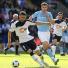 Top 50 transfer targets: Bolton's Gary Cahill takes the ball away from Manchester City's Edin Dzeko