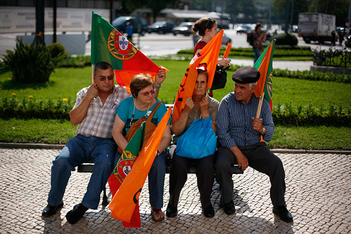 24 hours in pictures: Supporters wait before an electoral campaign in Coimbra, Portugal