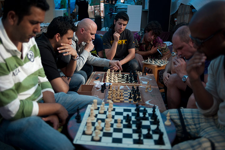 24 hours in pictures: Protesters play chess in Madrid's central Puerta del Sol square