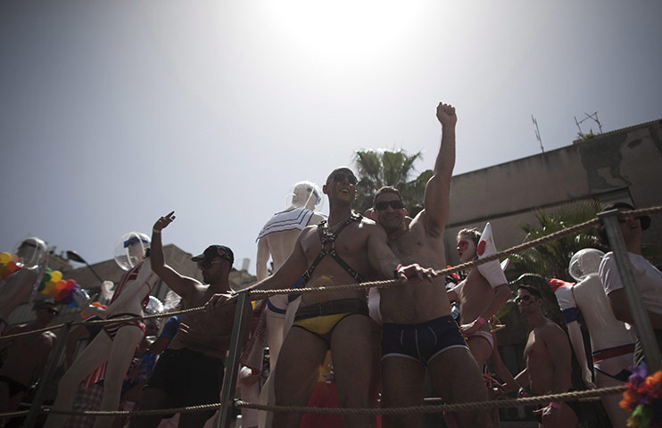 Gay Pride in Tel Aviv: Men dance at the Gay Pride Parade in Tel Aviv
