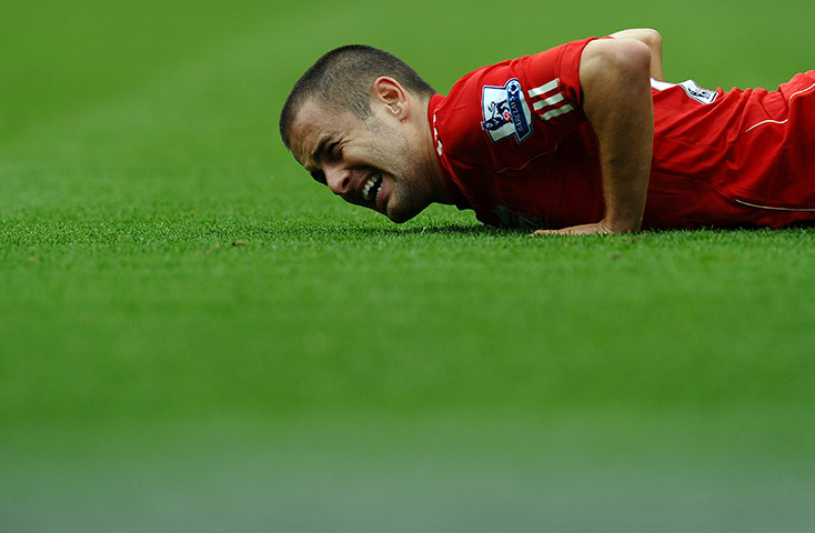 Unwanted players transfer: Liverpool's midfielder Joe Cole winces after a tackle