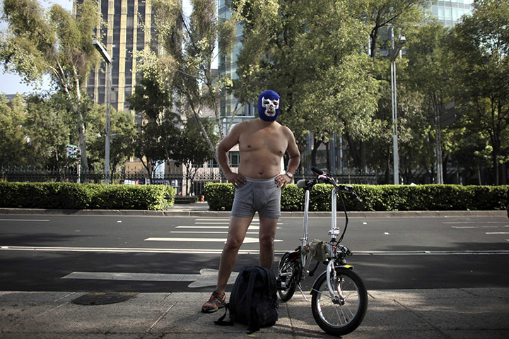 24 hours: Mexico City, Mexico: A cyclist wearing a lucha libre wrestling mask